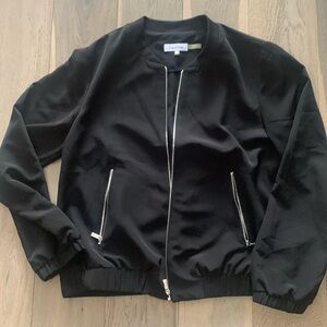 Calvin Klein, black light jacket with zipper pockets, size medium